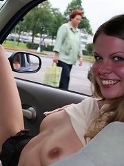 Teen whore shows pussy in her car at the parking...